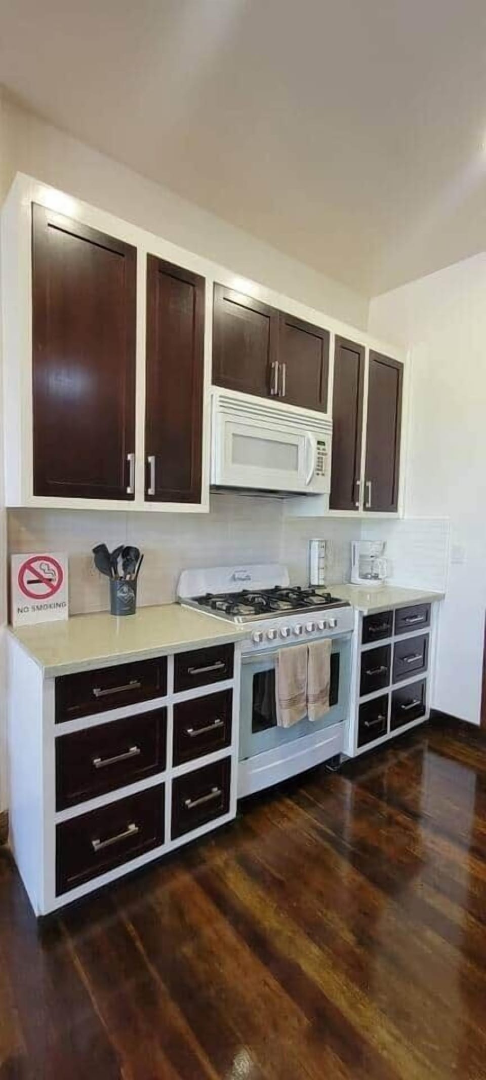 A spacious kitchen featuring ample counter space and modern appliances, fully stocked with cookware, utensils, and basic essentials—perfect for preparing and enjoying home-cooked meals in comfort.
