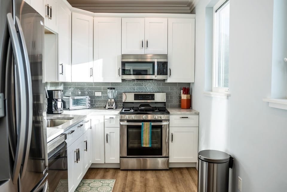 Fully equipped kitchen with modern appliances.