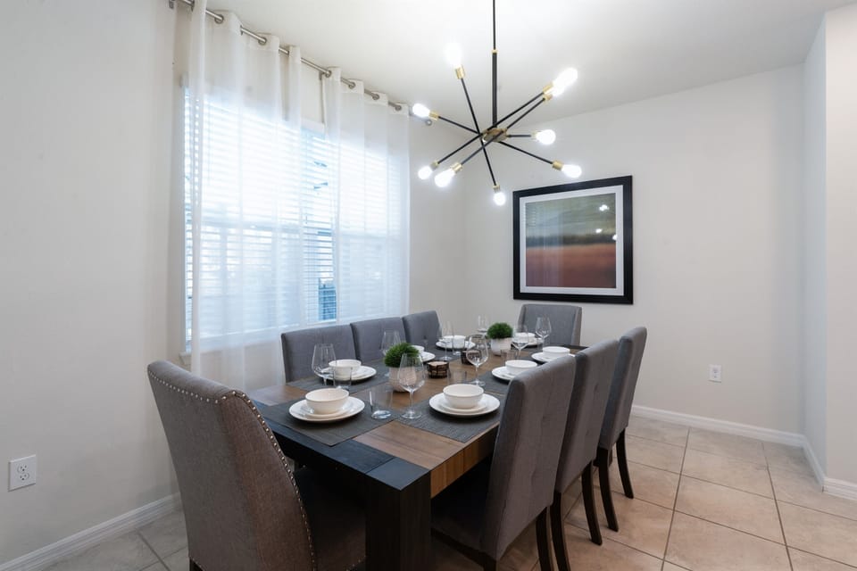 Gather around the elegant dining table in this Florida villa near Disney – seats 8 for fun family meals.