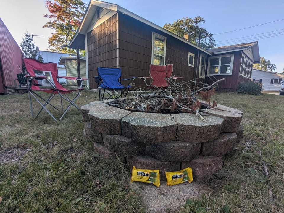 Firepit and Cottage from the rear corner (Rainbow Drive side)