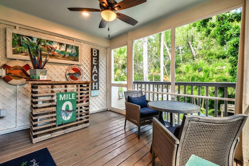 Unwind on the screened back porch, where gentle island breezes and the sounds of nature create the perfect setting for relaxation.