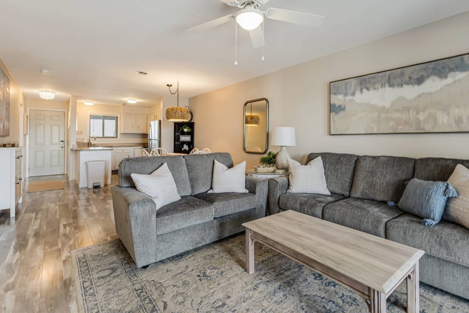 Cozy living area with a peek into the kitchen and dining space.