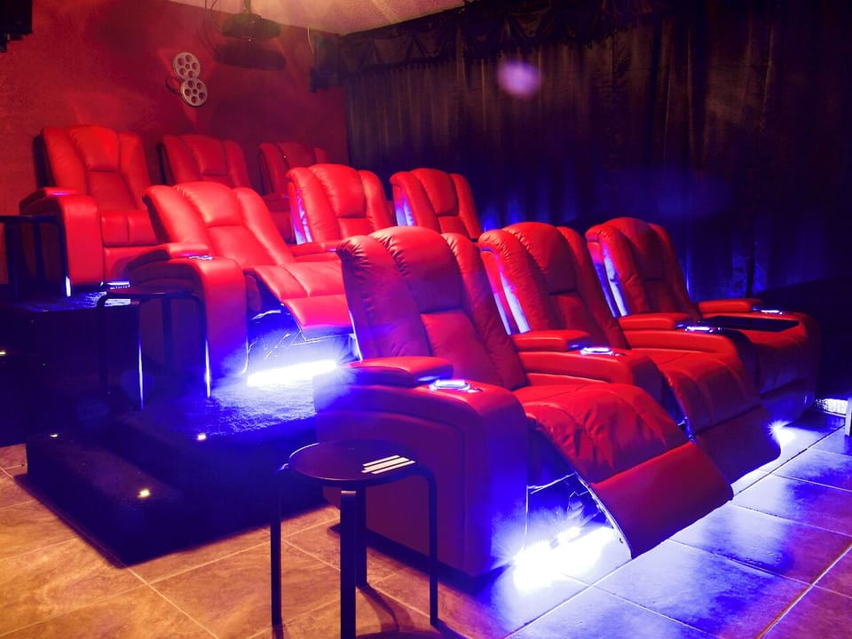 Electric reclining stadium seating for nine