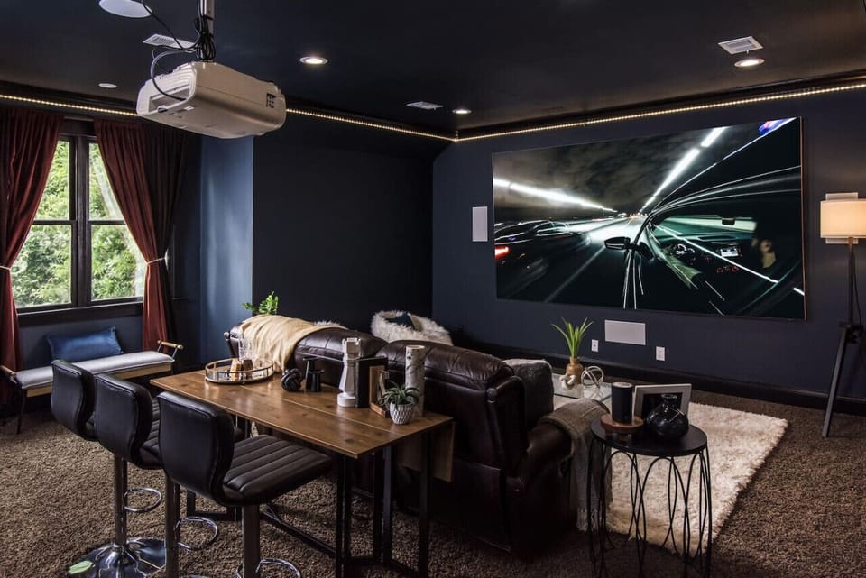 The ultimate in-home movie theater with a mini bar and room-darkening shades.