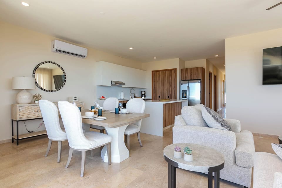Elegant dining area with seating for 8, perfect for family meals or gatherings with friends. Enjoy a stylish and comfortable space to dine while taking in the beautiful surroundings. 