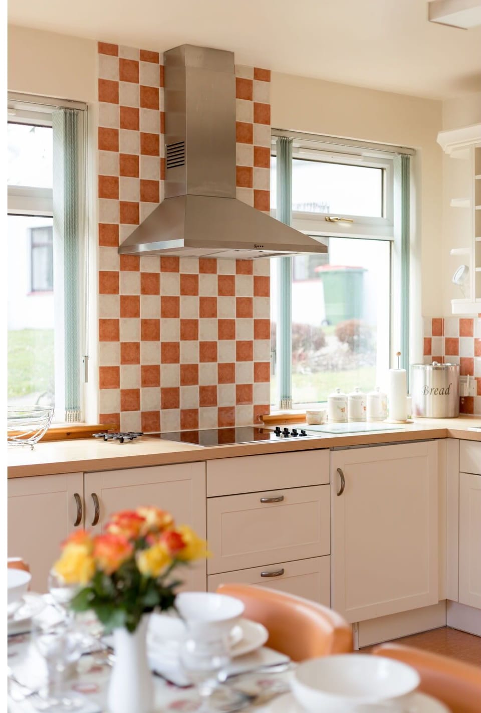 Kitchen, Interior Design, Flooring, Countertop, Orange, Floor, Kitchen Appliance, Cabinetry, Room, Tile