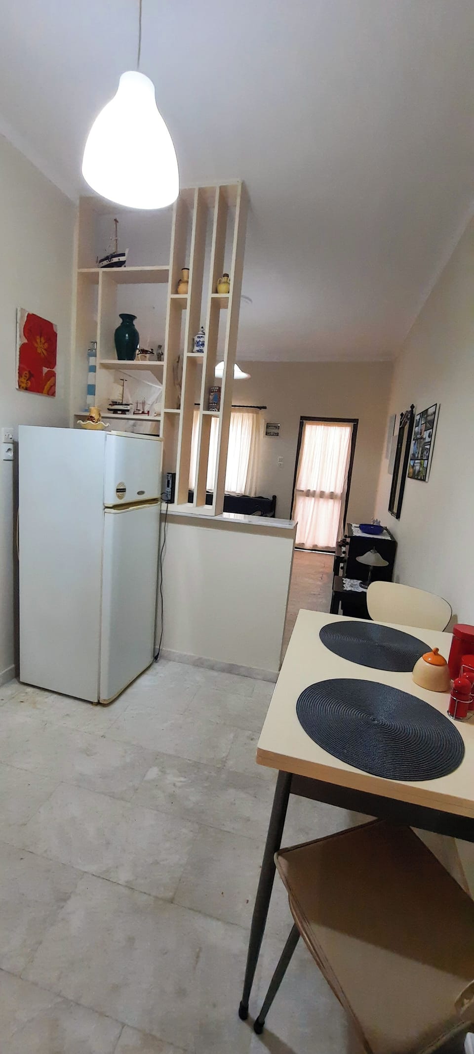 The kitchen (refrigerator, dining table)