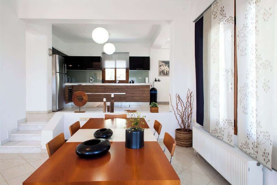 The living room's dining table that can host 8-10 persons.