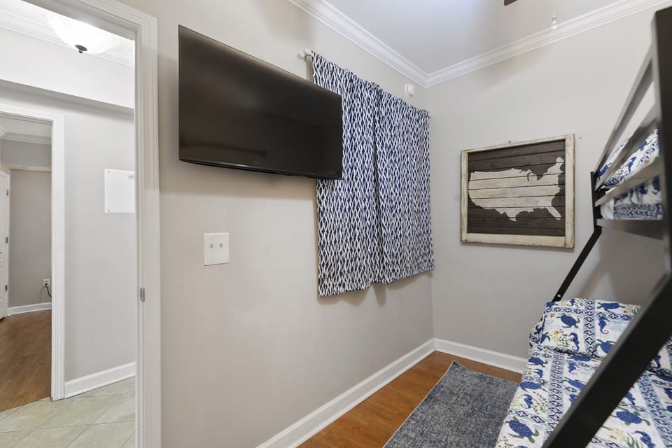 Bedroom 3. Twin over full bunk bed. Tv.