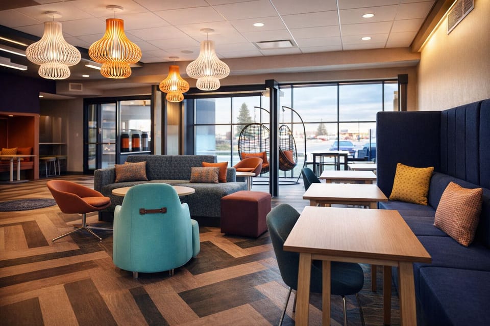 Unwind in the airy lounge with stylish seating and light.