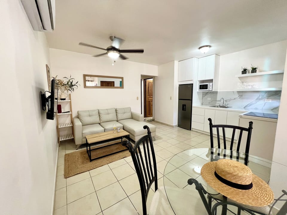 Open concept living area, full kitchen, and dining area.