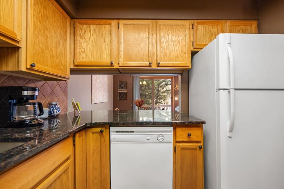Full kitchen, on the main floor, with a blender, drip coffee maker, ground coffee, tea & sugar.