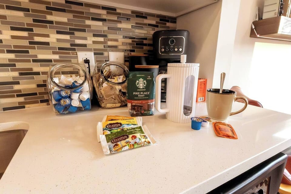 Don't worry, I didn't just take a picture of the Pike's Place and swap it out with Folgers. We have an electric and acoustic coffee maker as well as a kettle for your Sleepy Time or Chamomile tea as well as assorted creams and sweeteners and honey!
