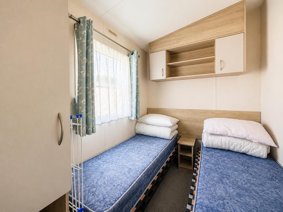 The second twin room is perfect for travelling with Granny and Grandad. They will love being able to retreat to their own space after a busy day with the family. The twin rooms feature a wardrobe so you can unpack and feel at home.