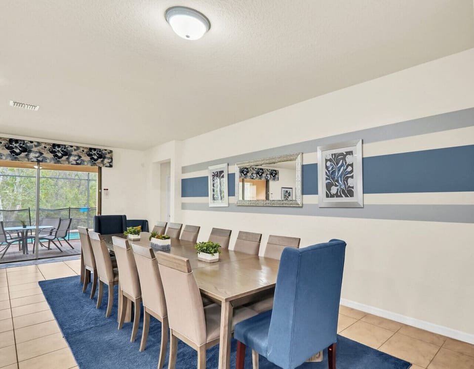 Shades of blue bring a calming yet luxurious vibe to this open-concept kitchen and dining space.