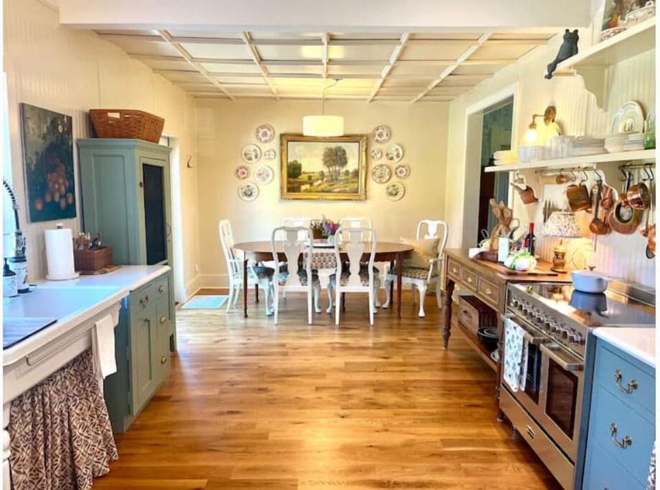 Farmhouse kitchen and dining space with French doors to back deck. 