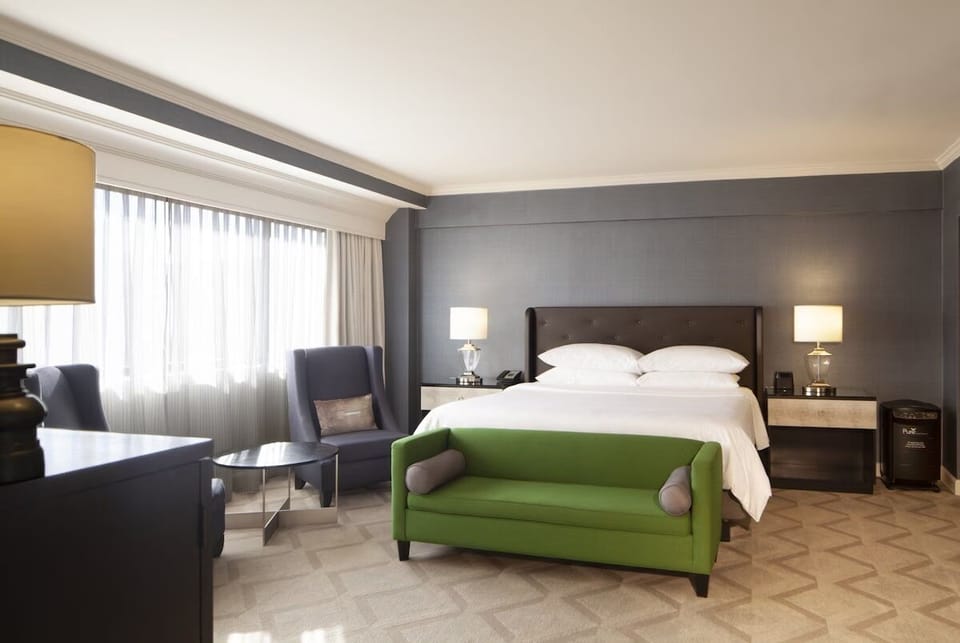 Linger in a bright, serene room designed for deep rest.