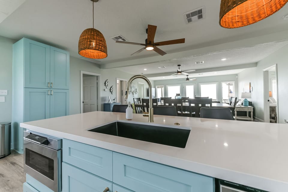 Kitchen sink overlooking the living room and dining room table so you won't miss anything that goes on while cooking. (Upstairs)