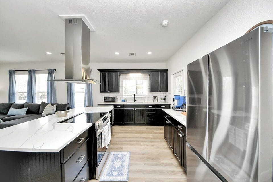 Not only is the kitchen functional, but it's beautiful too. It comes with all brand new stainless appliances, countertops, & flooring. 