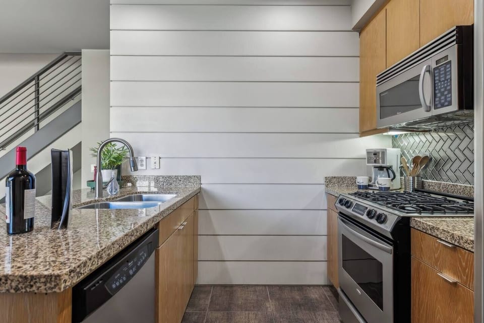 Welcome to our bright and spacious kitchen! Enjoy modern appliances, sleek granite countertops, and a cozy dining nook. Perfect for cooking and gathering, this inviting space is ideal for culinary adventures and memorable meals!