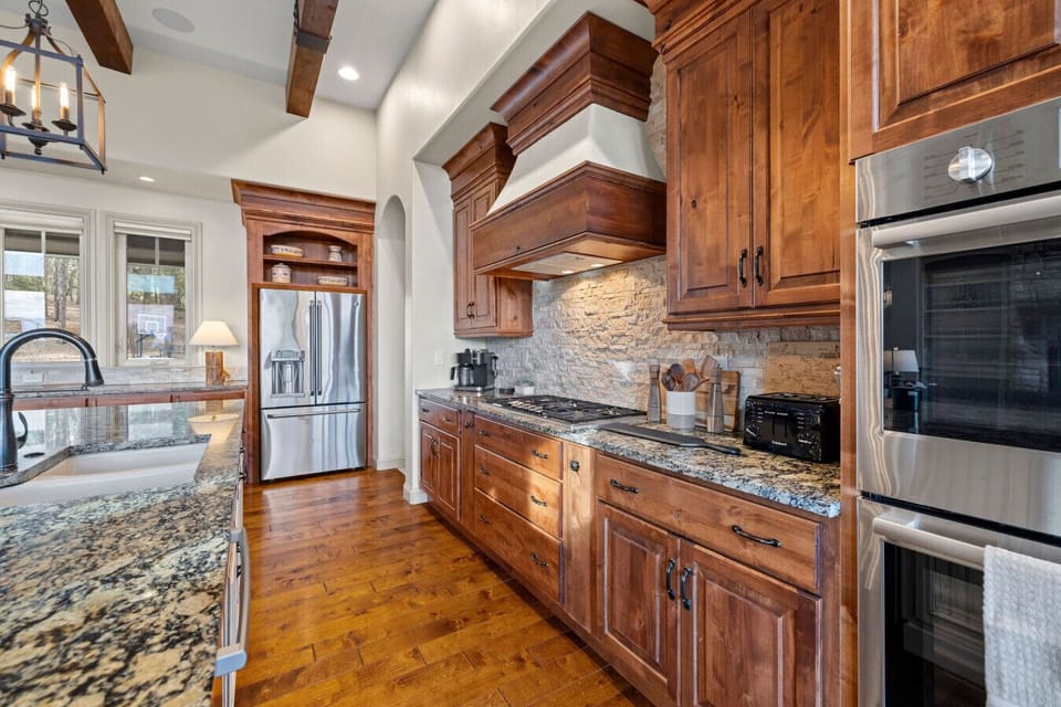 Every detail in this gourmet kitchen was chosen with care—from the gleaming stainless steel appliances to the sleek double ovens and five-burner gas cooktop. Whether you're prepping a quick breakfast or a holiday feast, you’ll have everything you need in 