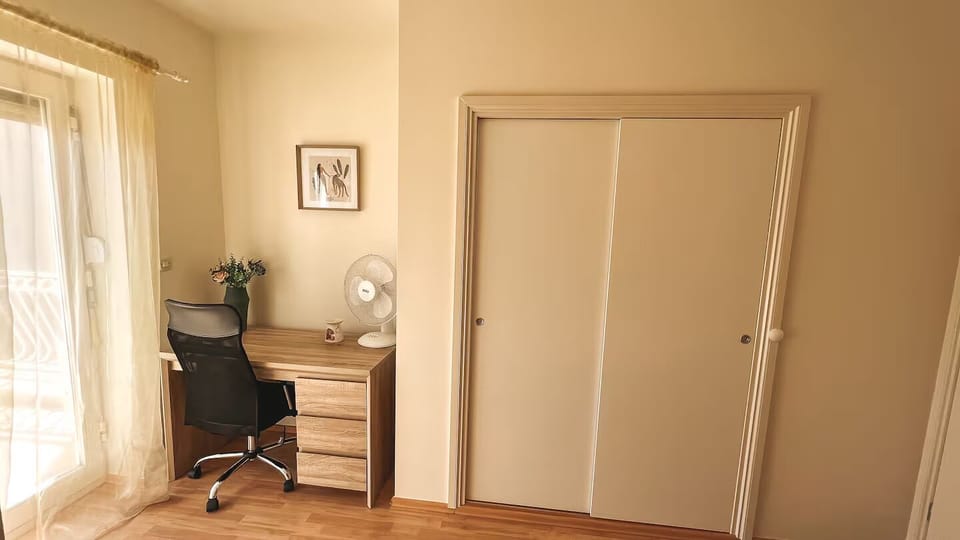 Bedroom built in closet and office table.