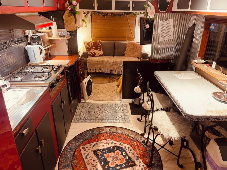 Kitchen through to sitting room with TV streamed services 