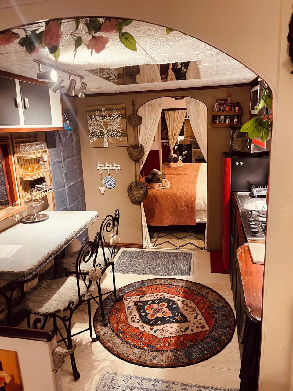 Eat in kitchen with wood fire and cozy bedroom at end of van 