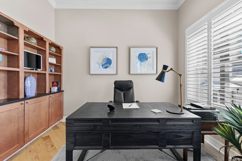 A sleek desk and ergonomic office chair provide the perfect setup for productivity.