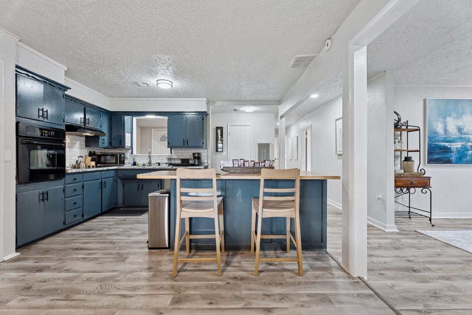The heart of the kitchen—this spacious island offers bar seating and drawers packed with silverware and prep tools for every occasion.