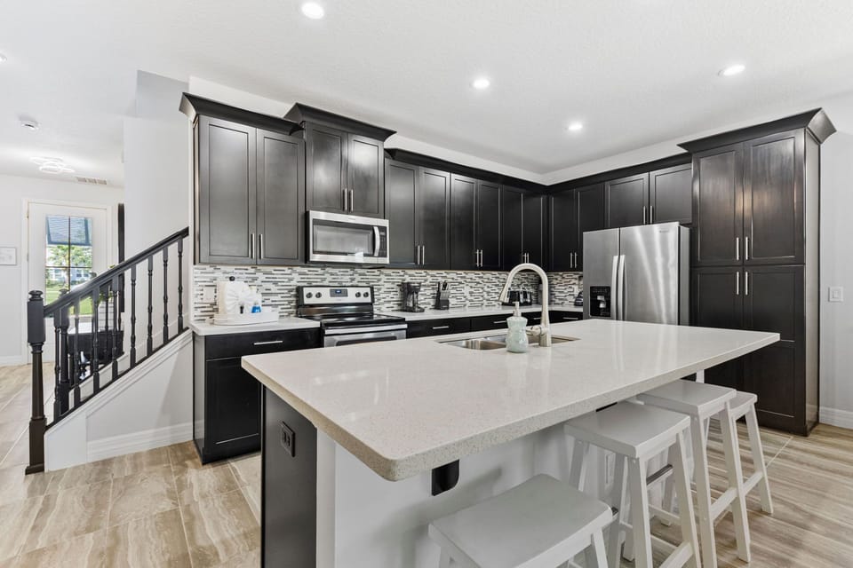 Kitchen with breakfast bar. 