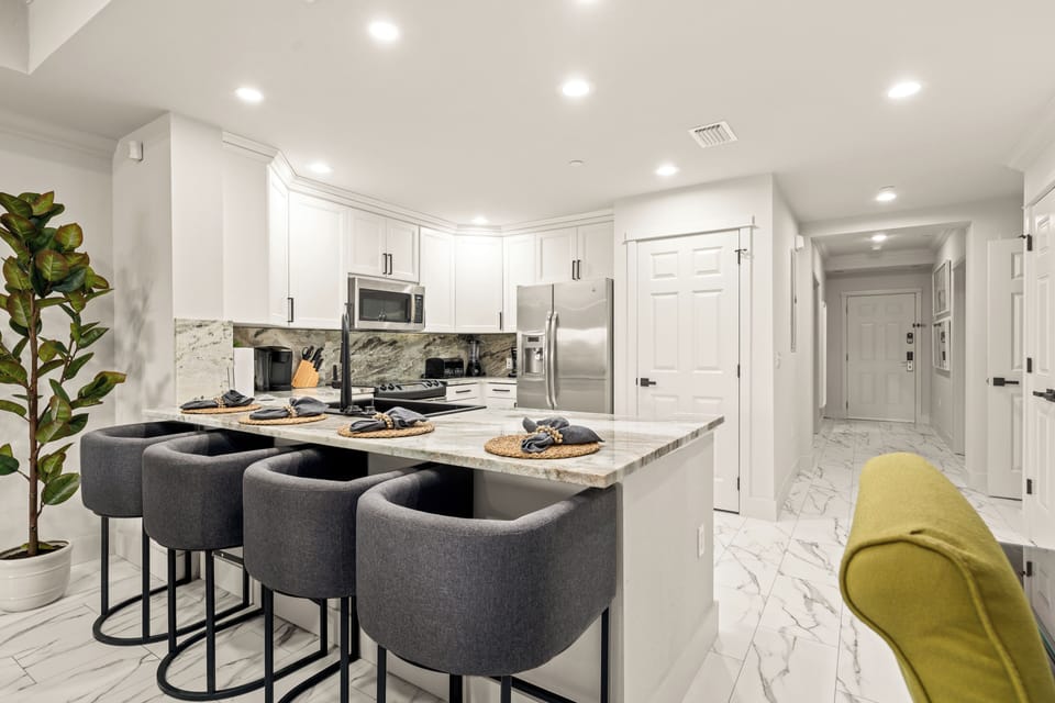 Breakfast bar with ample seating looking into the gourmet kitchen.