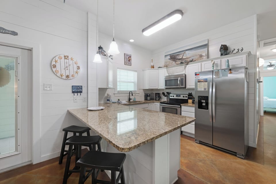 Three Stools at Kitchen Counter Keep Things Social and Lively