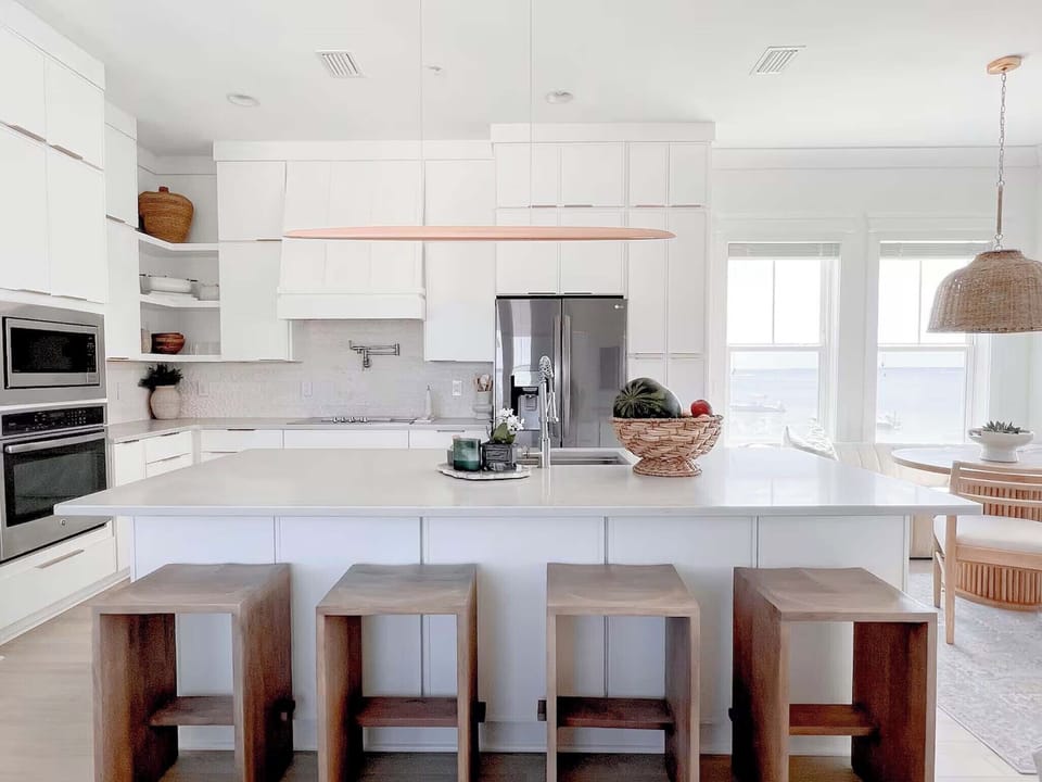 The kitchen island has seating for four