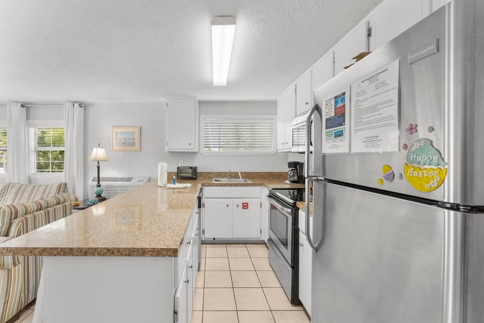 modern kitchen with granite countertops and stainless steel appliances