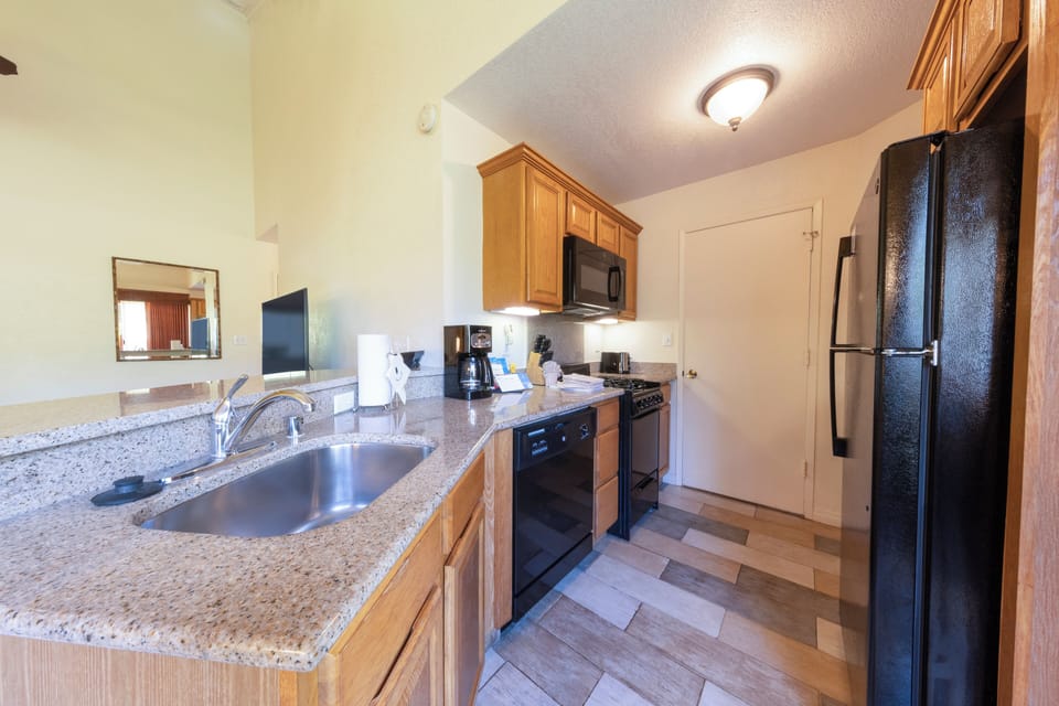 Cook with ease in the full kitchen with granite counters.