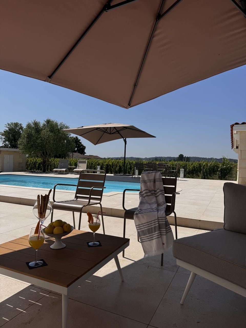 The heated pool, open from April to October, offers relaxation all season. Around the pool, enjoy comfy sofas, sun loungers and parasols for a true holiday vibe.