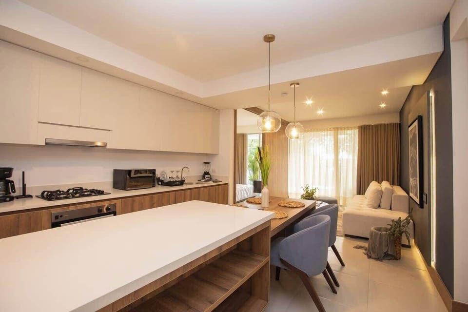 Open kitchen layout. Kitchen is fully stocked with everything need to cook a meal.
