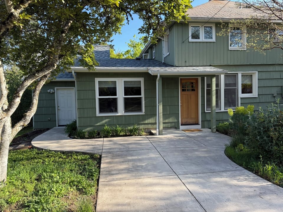 Driveway in front of the house accommodates a small/mid size car.  