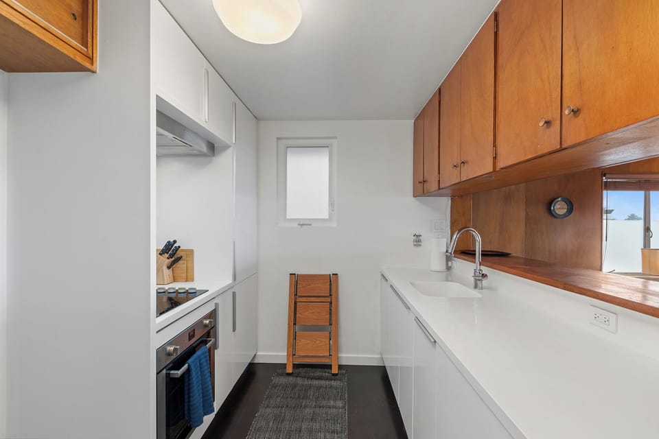 Kitchen with stove, dishwasher, french press coffee maker