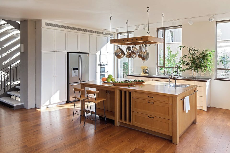 The island in the kitchen seats 4.