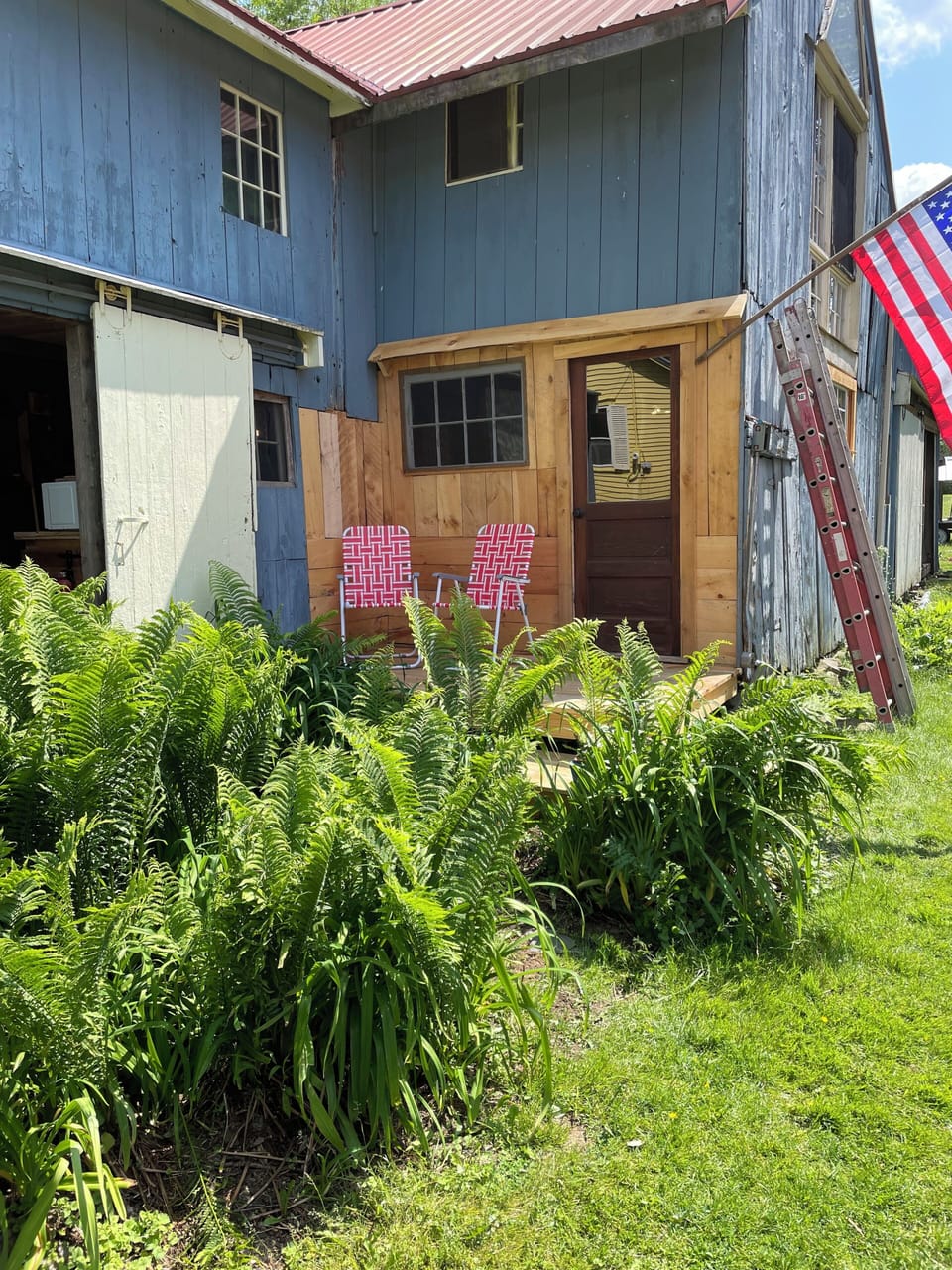 Entrance to the bunkhouse with its private deck and webbed lawn chairs