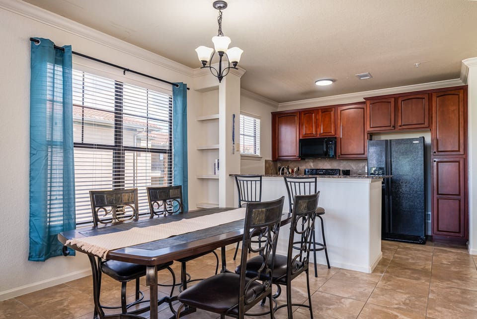 Dining room and kitchen showing table and seating for 4