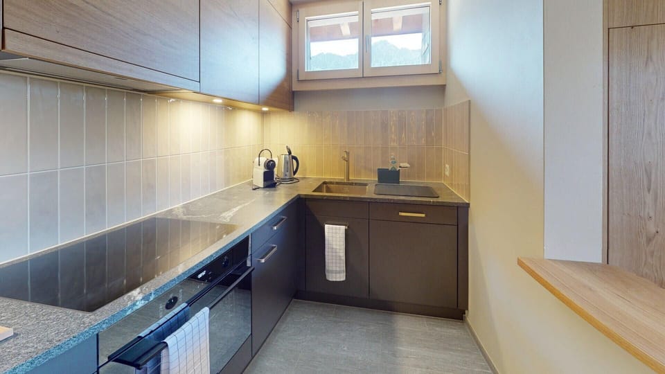 Kitchen with coffee machine, oven, dishwasher etc.
