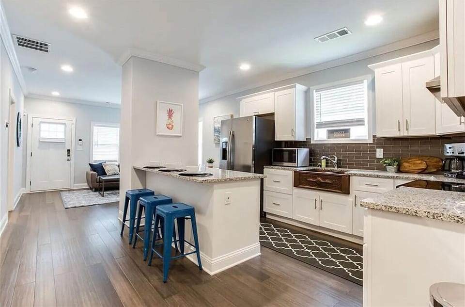 Kitchen Area with Kitchen Island and 3 bar stools