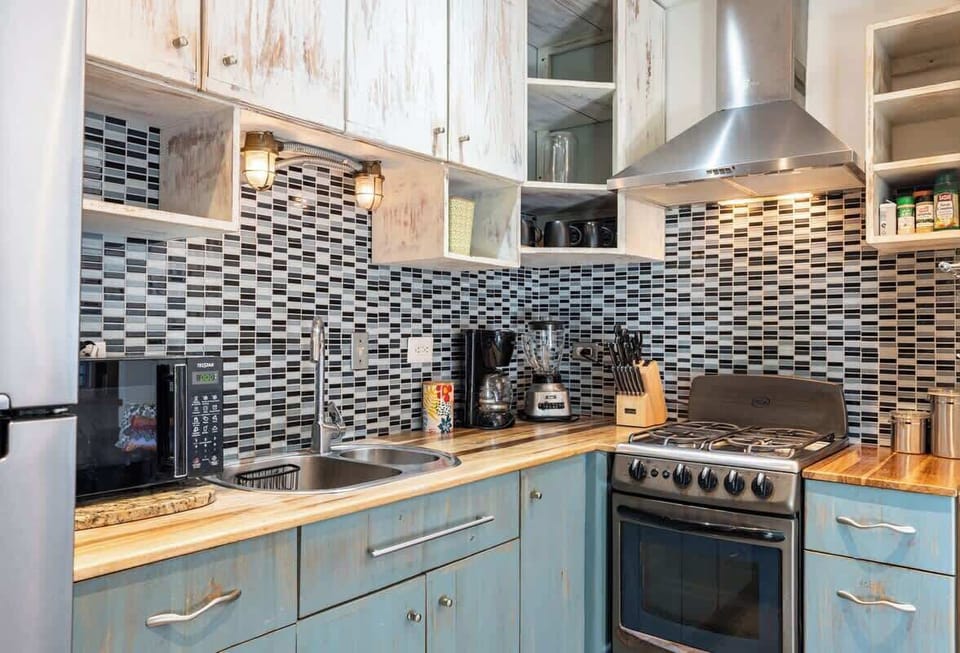 Ample Cabinetry Stocked w/ All Cooking Utensils Needed to Prepare Your Meals. Access to Cooking Basics, Coffee, Tea and Stevia.