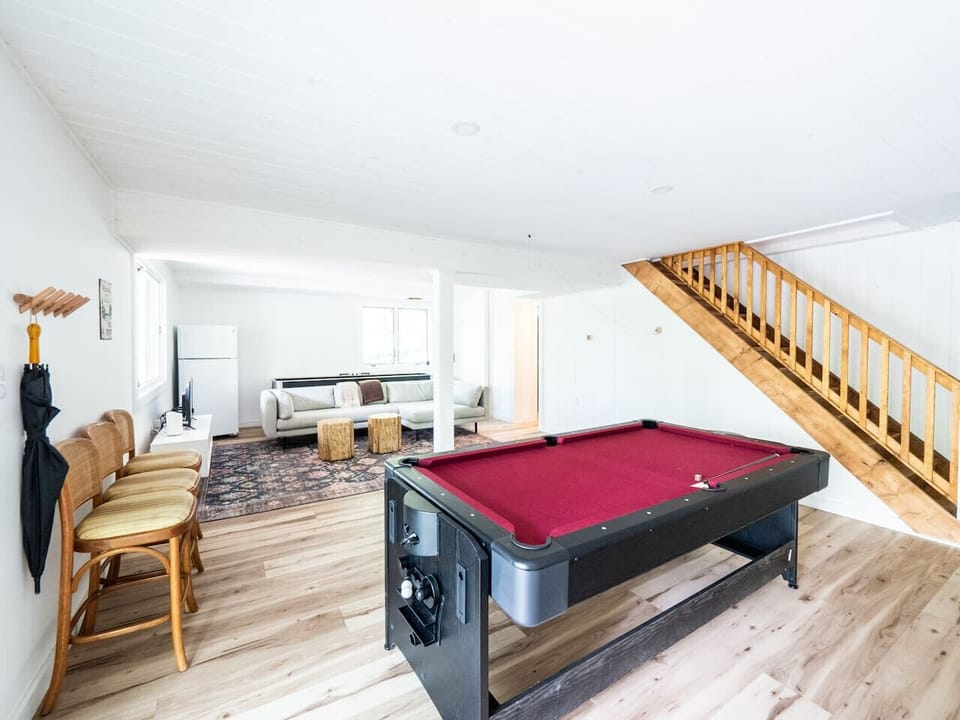 Game room with pool / ping pong and shuffleboard. Large smart TV also downstairs for movie nights