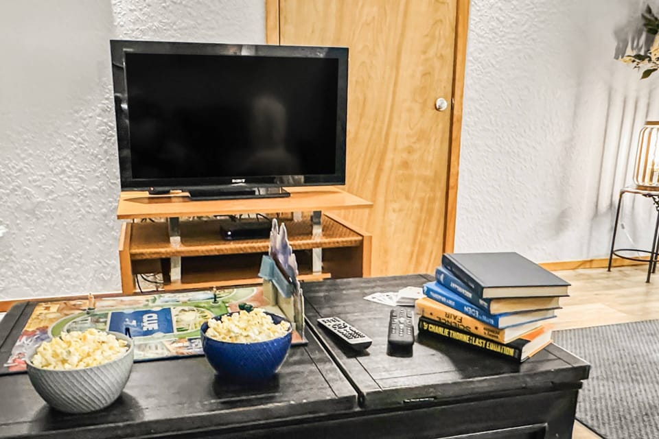 Enjoy a comfy seat with popcorn in hand, and relax while watching your favorite show on the large TV. Side A.