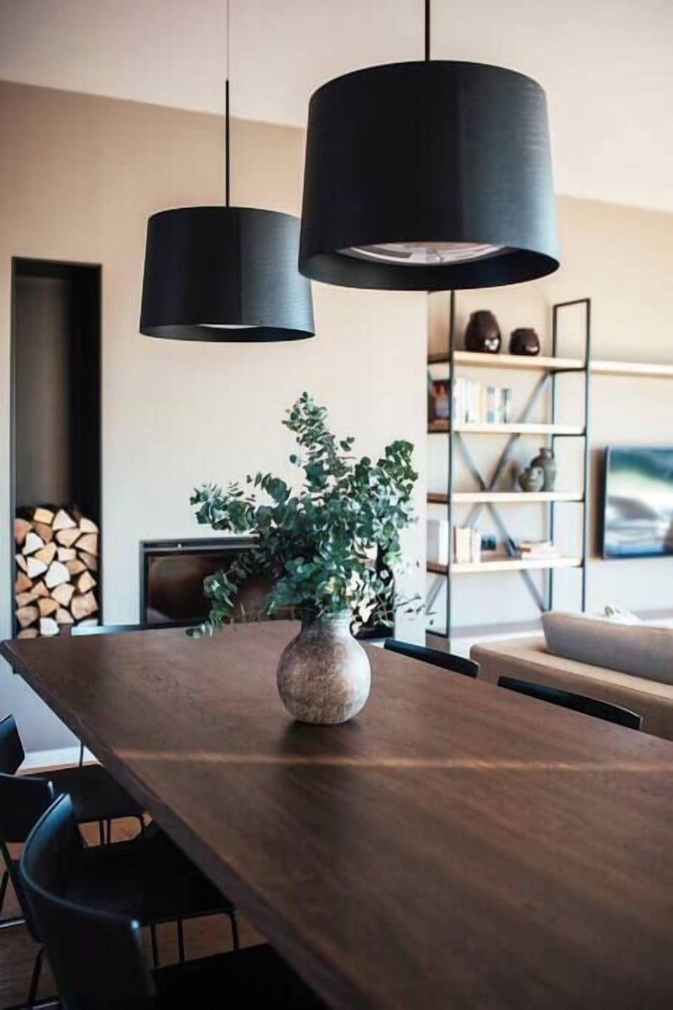 A fireplace next to the dining table