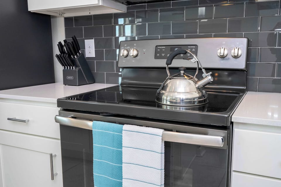 Stovetop Close-Up: Sleek electric range ready for pancakes in the AM or pasta at midnight.